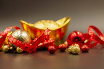 Golden ingot gift for Chinese Holiday with red ribbon