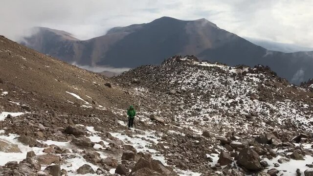 Mountaineer climbing at Mount Savalan (Sabalan) summit in Savalan, Iran. Savalan is the third highest mountain in Iran. It&rsquo;s 4811 meters altitude.