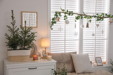 Beautiful room interior decorated for Christmas with potted firs