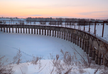 Dam on the pond on a winter morning