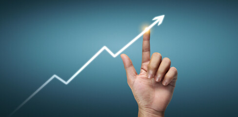 Hand touching  graphs of financial indicator and market analysis chart