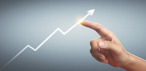 Hand touching  graphs of financial indicator and market analysis chart