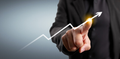 Hand touching  graphs of financial indicator and market analysis chart