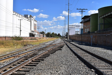 Fototapeta na wymiar Overland view of the crossing of the train tracks on Inglaterra avenue