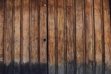 Background of a vertical striped rustic wooden door