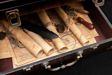 Vintage wooden suitcase with scrolls with wax seal, old map, seal.