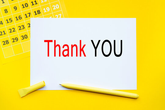 THANK YOU. Abstract calendar yellow collour on a yellow background , Business concept written on notepad. Business and financial conzept.