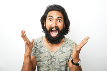 Surprised screaming bearded young man portrait on white.