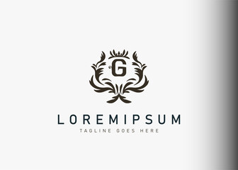 Heraldic initial letter G logo design. Vector illustration of elegant floral letter G icon design. Modern logo design with emblem style.