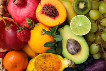 Assortment of fresh exotic fruits as background, closeup