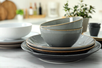 Fototapeta na wymiar Set of beautiful ceramic tableware on white table in kitchen