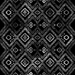 Geometric klim ikat pattern with grunge texture
