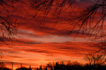   sunrise with fiery orange clouds