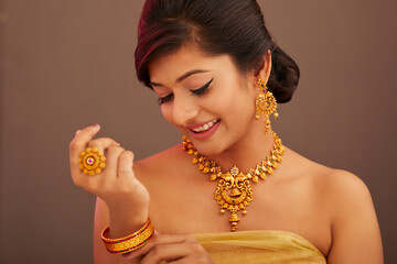 Beautiful Indian young women portrait with Indian traditional jewelry studio shot.