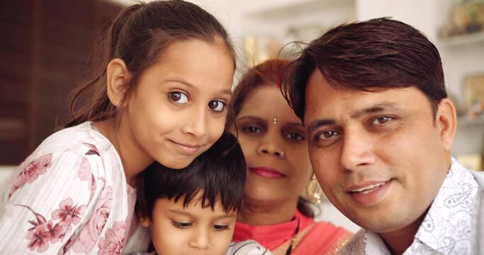 Slow-motion of parents, husband and wife, along with their sweet cute two kids male and female pose for camera pov selfie photo video and smile 