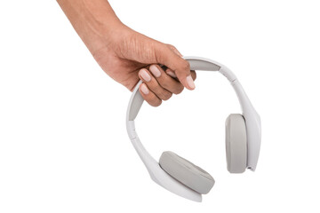 Hand holding white headphones on white background.