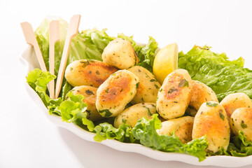 Cottage cheese served with green on white.