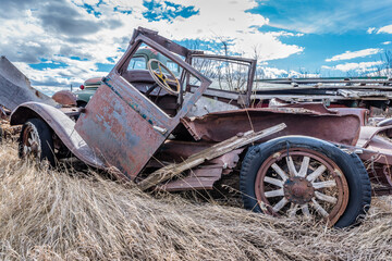 The body of a vintage car abandoned on the prairies in Saskatchewan