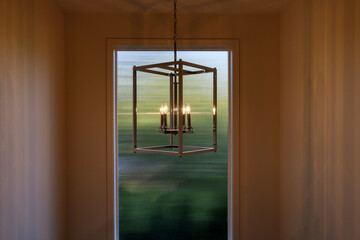 light fixture in front of a window