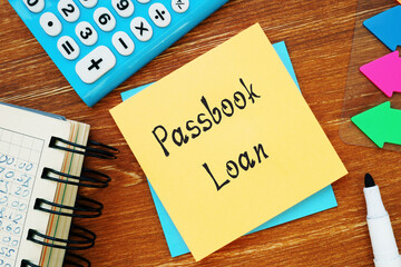 Financial concept about Passbook Loan with inscription on the piece of paper.