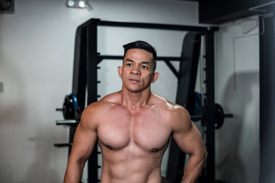 A buff, sexy and fit 40 year old asian fitness model at the gym or health  club. Healthy living for middle aged men concept. Stock Photo | Adobe Stock