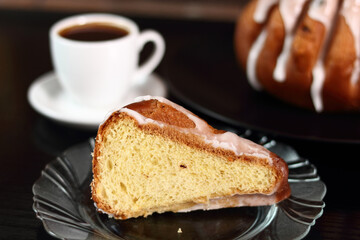 Cake with sugar icing and coffee cup