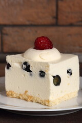Frozen cheesecake with blueberry and raspberry