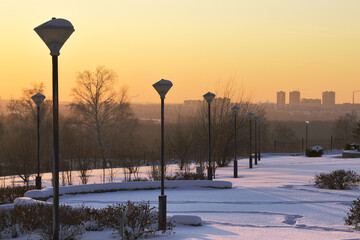 Park in the snow in the evening