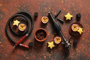 Parts of hookah, tobacco and fruits on grunge background
