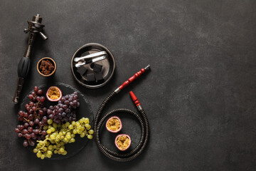 Parts of hookah and fruits on dark background