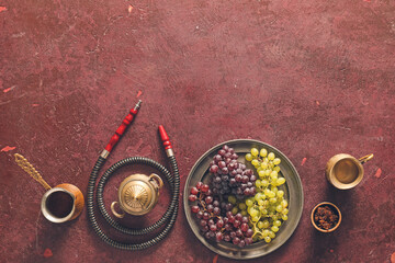 Parts of hookah and grape on grunge background