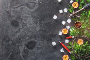 Composition with parts of hookah on dark background