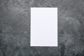 Blank paper sheet on dark background