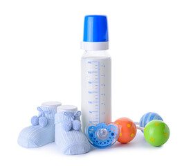 Bottle of milk for baby and accessories on white background