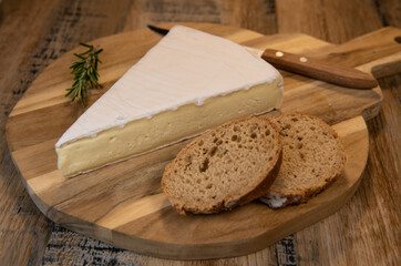 Brie cheese triangle with bread and parsley, High quality photo