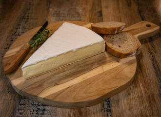 Brie cheese triangle with bread and parsley, High quality photo