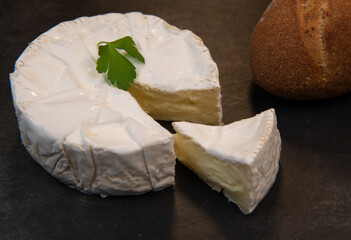 Camembert cheese on a wooden background, High quality photo