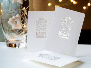 Three white postcards with the inscription merry Christmas with festive decorations