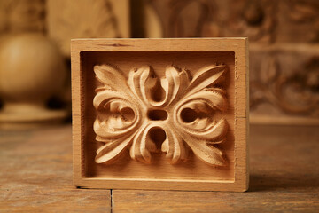 Wood carving. Woodworking. Graphic stylish pattern carved on a wooden background close up macro