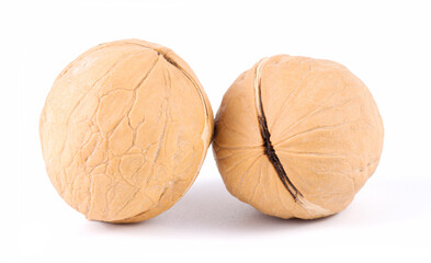 Two tasty wallnuts isolated on white background