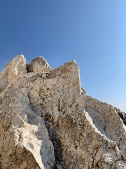 Rocky sea stones in the blue sky background, coast