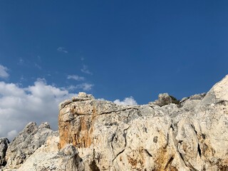 Rocky sea stones in the blue sky background, coast