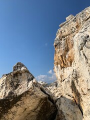Rocky sea stones in the blue sky background, coast