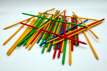 Game of Mikado, Shangai game. Colored plastic sticks isolated on white background.