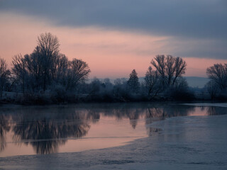 sunrise over a lake in winter