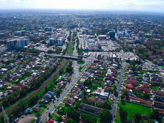 Panoramic Aerial View of Sydney Western suburbs showing house roof tops roads cars and other buildings 