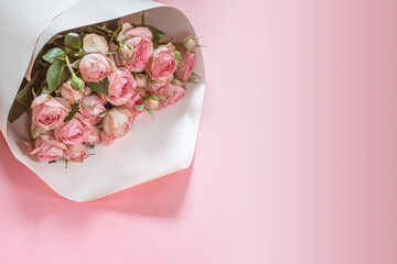 Pink roses bouquet on pink background, Valentine's day background