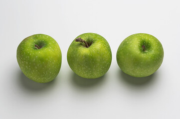 Three green apple isolated on white background with clipping path