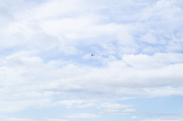 Flying plain in the white clouds and blue sky.
