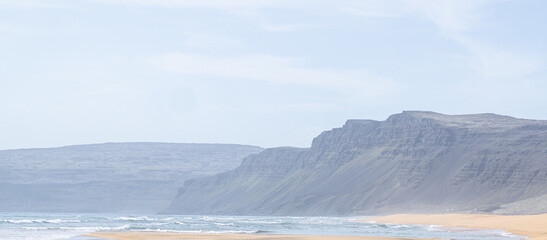 Fototapeta na wymiar Icelandic white beach and killer waves.